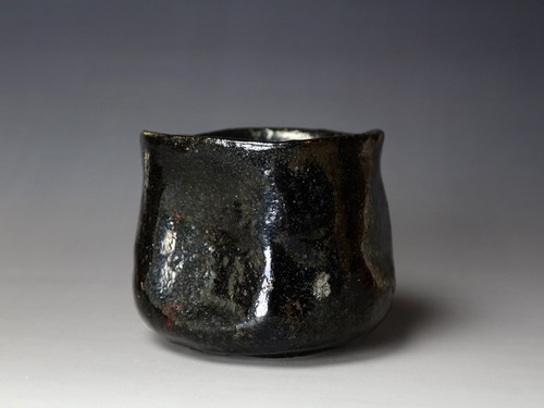Black raku chawan with low - raku,